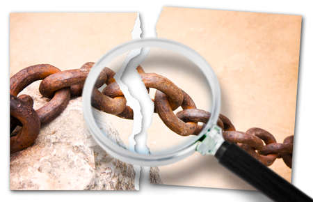 Look for the reasons for relationship break-ups - breaking the chains - Focus concept image with a ripped photo of an old rusty metal chain seen through a magnifying glass.の写真素材