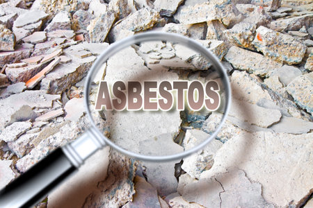 Looking for dangerous asbestos particles in industrial waste after demolishing a concrete buildingの写真素材