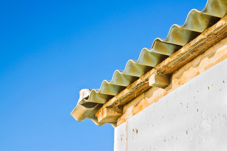 Wooden shack with a dangerous asbestos roofの写真素材