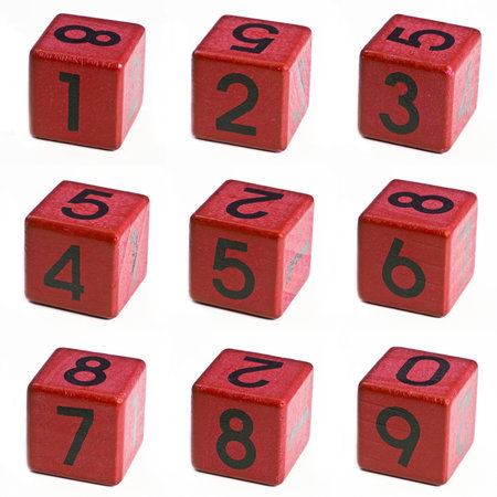 Red wooden cube with numbers on white