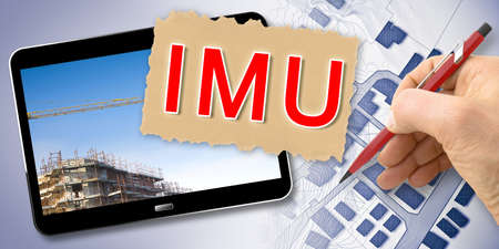 IMU (which means Unique Municipal Tax) the most unpopular italian tax on land and buildings - Concept with 3D render of laptop and building.の写真素材