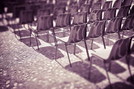 Chairs of an outdoor cinema - tilt shift filter added - toned imageの写真素材