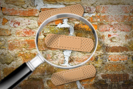 Renovation of an old cracked brick wall - concept image with copy space
