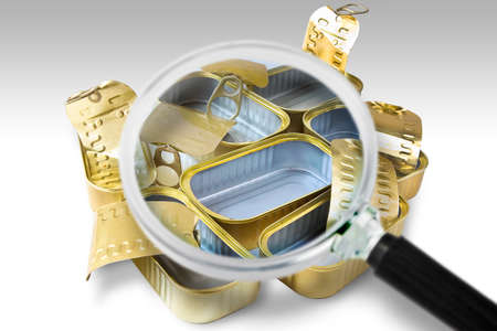 Group of opened metal box for corned beef, canned food or canned fish - Concept image seen through a magnifying glassの写真素材