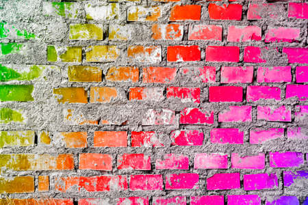 Colorful brick wall background with multi colored rainbow effectの写真素材