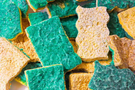 Old abrasive used sponges for household cleaning of kitchen: attention, they can hide dangerous bacteriaの写真素材