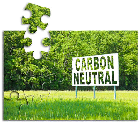 CO2 Carbon Neutral concept against an advertising billboard immersed in nature - solutions concept in jigsaw puzzle shapeの素材 [FY310177114344]