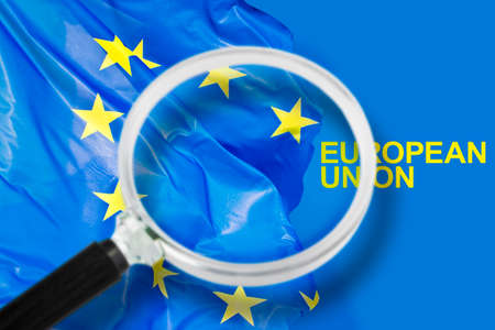 Searching the problems of contemporary European Union - Focus concept with magnifying glassの写真素材