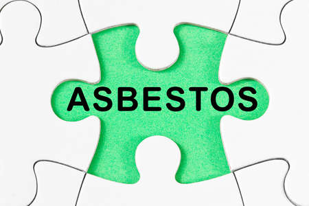 Asbestos text - Problems, strategy and solution concept in jigsaw puzzle shapeの写真素材