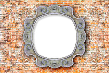 Old carved stone frame with blank space in the middle on brick wall backgroundの写真素材