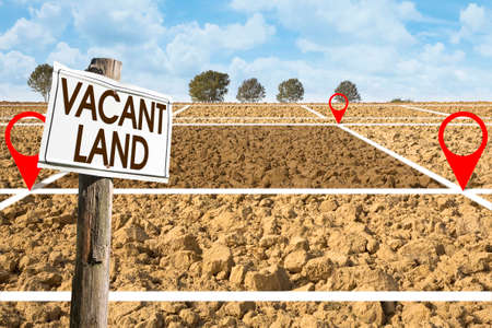 Plowed field with signboard and Vacant Land text - Land plot management - Real estate concept with a...
