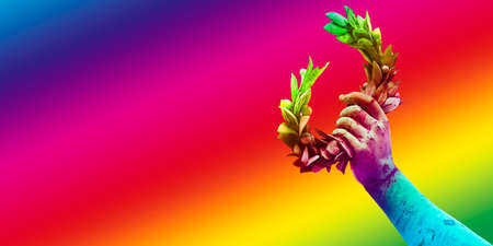 Hand holds a laurel wreath - bronze statue success and fame concept image with copy space
