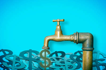 Close the faucet: don't waste your money - concept image with brassa faucet from which dollars come outの写真素材
