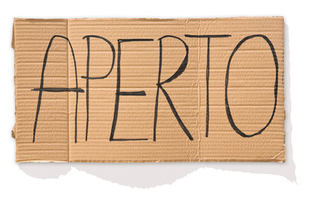 Open sign in Italian language against a cardboard - Aperto means openの写真素材