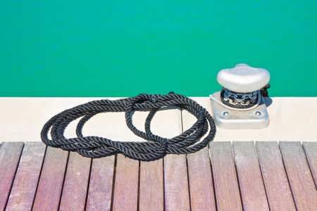Cleat for mooring boats on wooden platform
