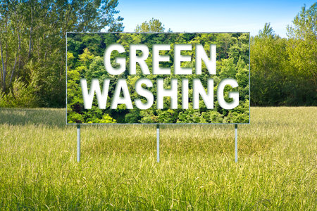 Alert to Greenwashing - concept with advertising signboard in a rural scene with trees on backgroundの写真素材