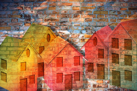 Public housing concept with cardboard houses against a brick wallの写真素材