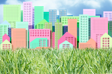 Planning a new city - Construction industry concept with an imaginary cityscape with buildings against a green areaの写真素材