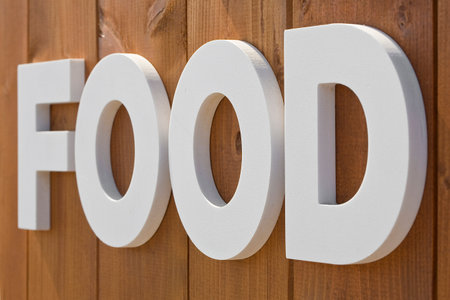 Food sign against a wooden backgroundの写真素材
