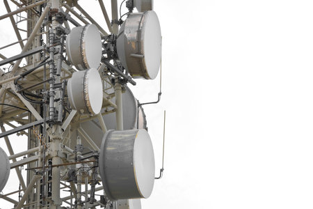 Base radio station for global communications services against a cloudy sky - concept with copy space