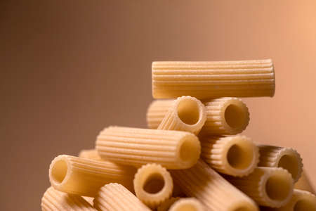 composition of uncooked rigatoni italian pastaの写真素材