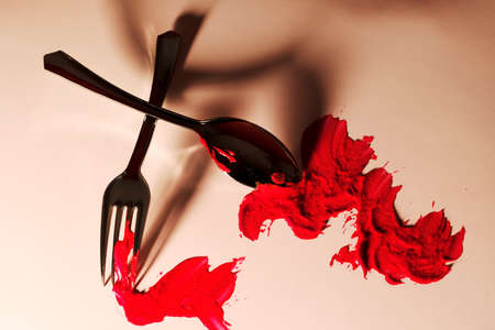 Fork and spoon on a tableの写真素材