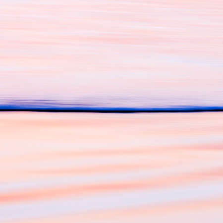 Vivid lights of the sea sunset with long exposure effect