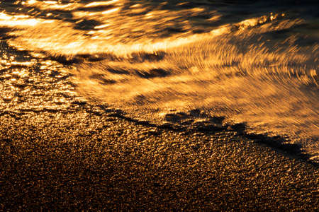 Vivid lights of the sea sunset with long exposure effectの写真素材
