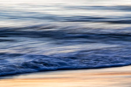 Vivid lights of the sea sunset with long exposure effectの写真素材