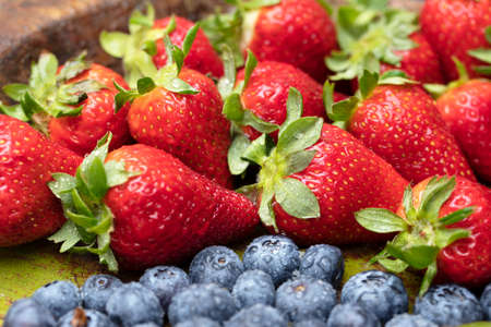Fruits on plate. Wooden surfaceの写真素材