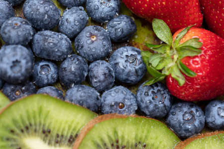 Fruits on plate. Wooden surfaceの写真素材
