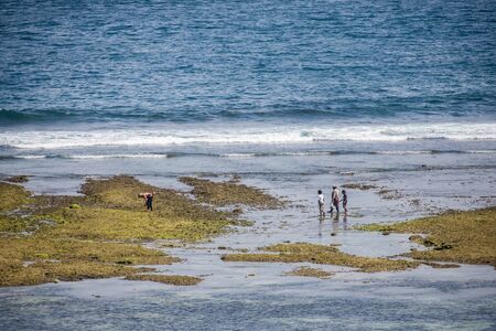 Indonesian family at beachの写真素材
