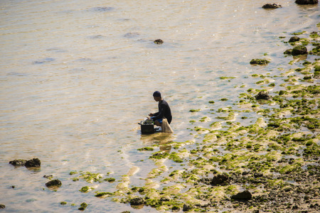 BALI, INDONESIA - OCTOBER 2018: Indonesian fishermanのeditorial素材