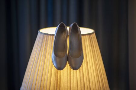 Pair of white wedding shoesの写真素材