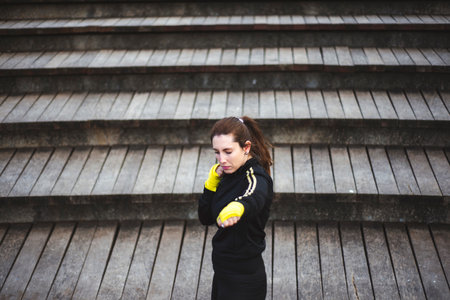 Girl training body combat at park. Self defense conceptの写真素材