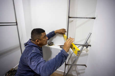Colombian metalworker preparing the metal structure during workの写真素材