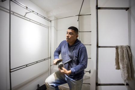 Portrait of Colombian metal carpenter preparing toolの写真素材