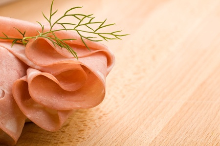 sandwich with mortadella with thin cutted slices of italian mortadella sausage