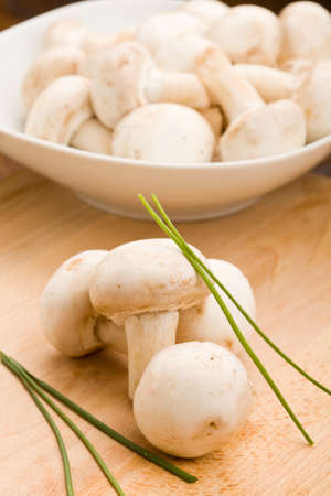 delicious raw mushroomw on chopping boardの写真素材