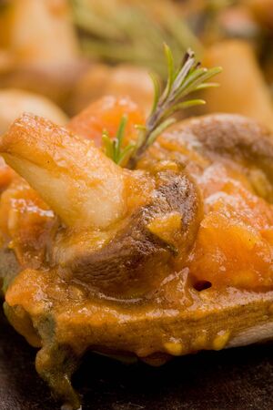 photo of cooked mushrooms with fresh tomatoe and rosemaryの写真素材
