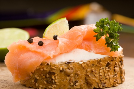 photo of delicious crispy cereals bread with smoked salmonの写真素材