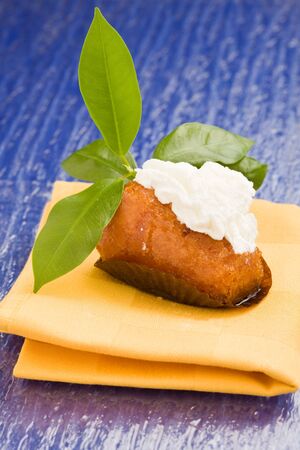  photo of italian pastries on yellow cloth called babàの写真素材