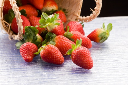photo of delicious red strawberries inside a basketの写真素材