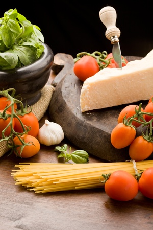 photo of ingredients for coocking spaghetti with tomatoe sauceの写真素材