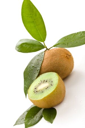 photo of cutted kiwi with green leaves on white isolated backgroundの写真素材