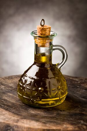 photo of delicious extra virgin olive oil inside a glass bottleの写真素材