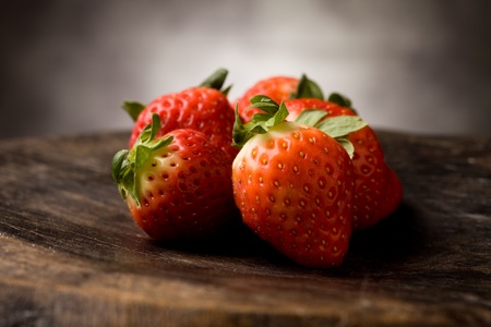photo of delicious red strawberries on wooden tableの写真素材
