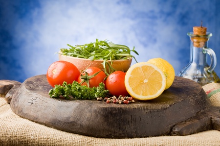 photo of different vegetables on wooden chopping board ready for cookingの写真素材