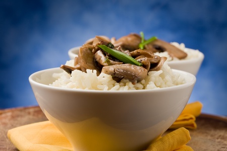 photo of delicious risotto with mushrooms on wooden tableの写真素材