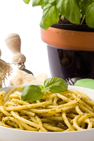 photo of traditional italian food pasta with pesto with different ingredientsの写真素材